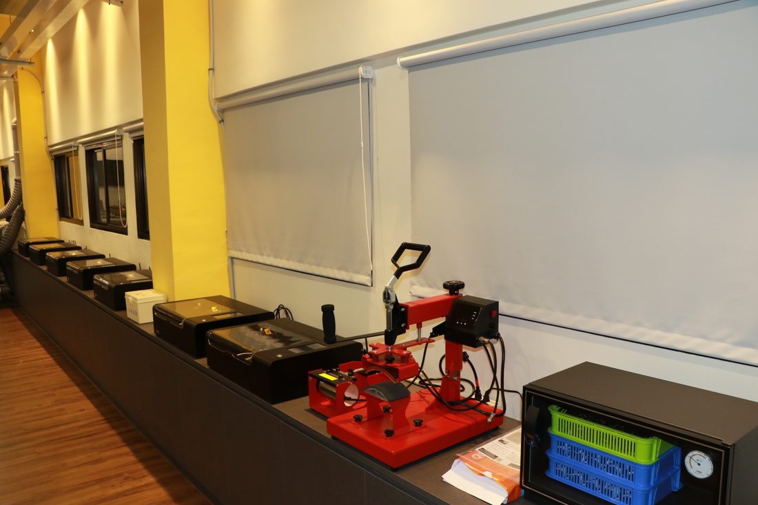 A 3D printer at work on a student bench