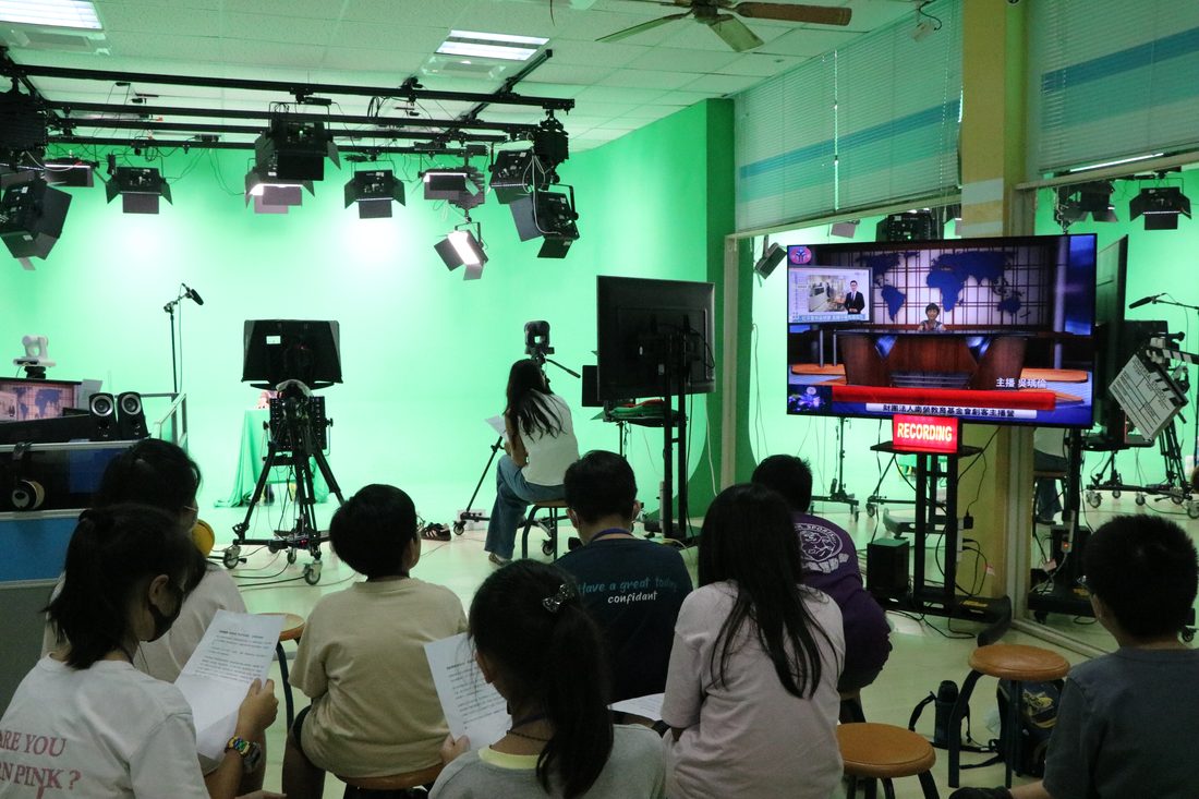 Students watching a live broadcast take